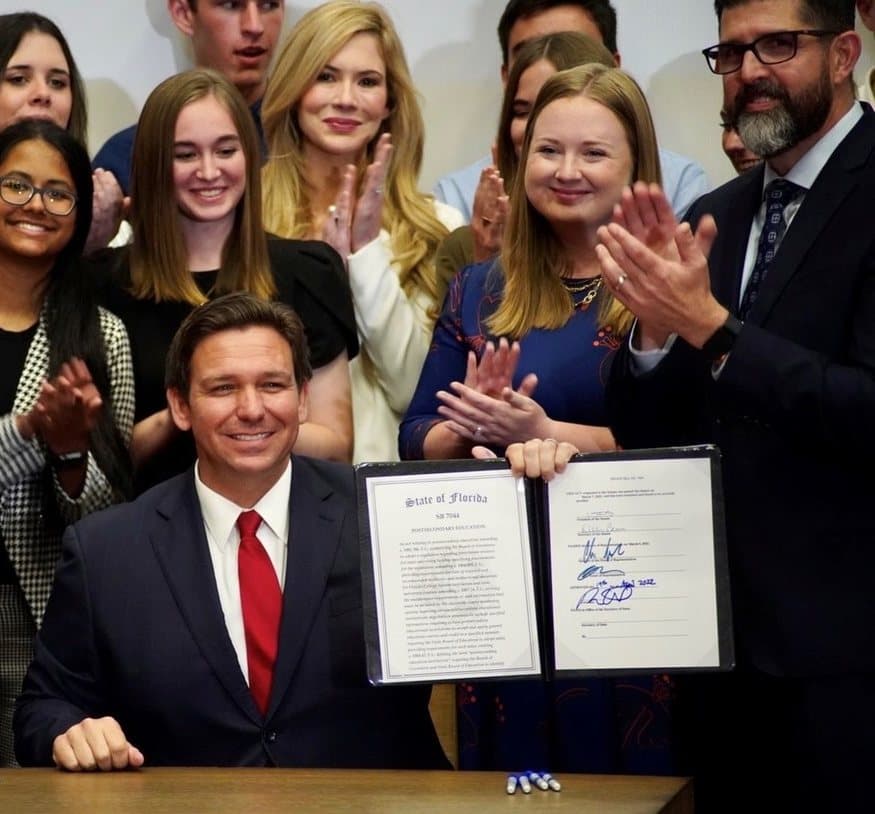 The April 2022 signing of SB 7044, Florida’s postsecondary education bill, with Ashley Bell Barnett among those gathered